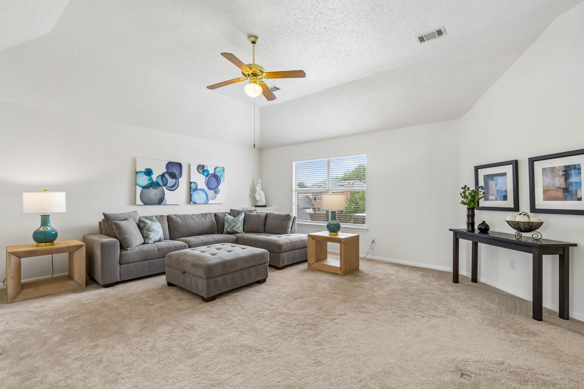 Upstairs gameroom at 7513 Caribbean Drive in Rowlett TX with carpet and natural light